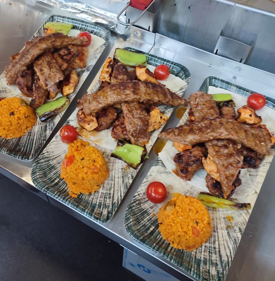Mixed grill trays plated up for service