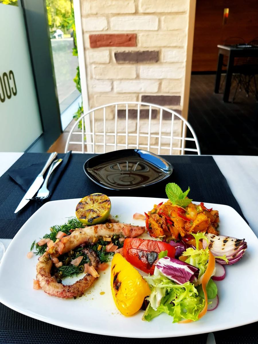 Grilled seafood plate with charred vegetables