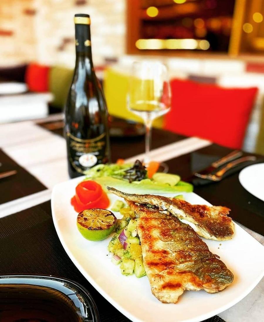 Sea bass fillet with grilled vegetables and olives