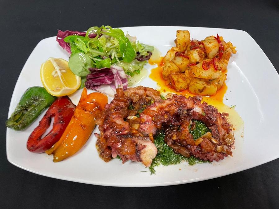 Seafood plate with peppers, herbs and leaves