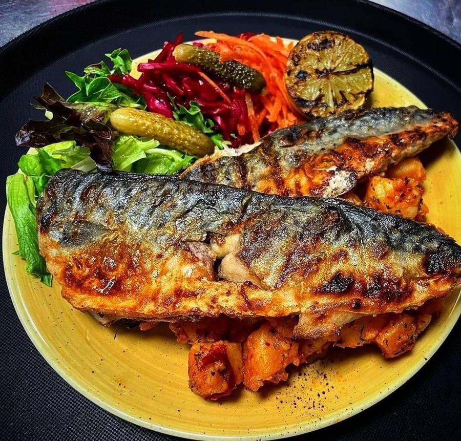 Grilled mackerel with pickles and dressed leaves