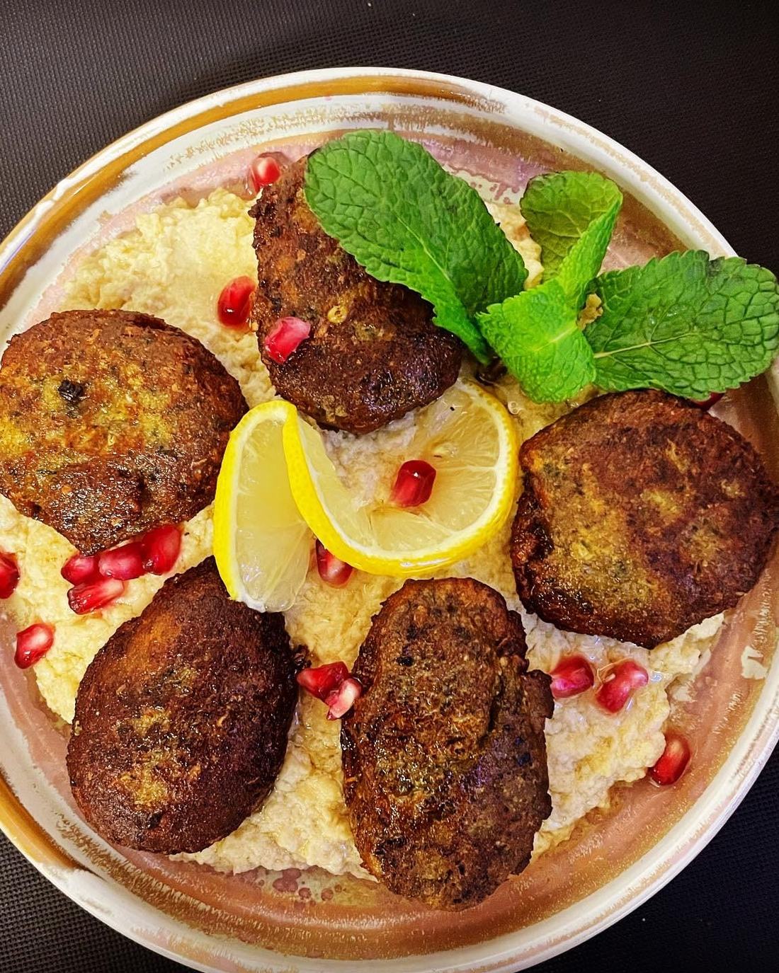 Spiced kofta with pomegranate, mint and whipped yoghurt